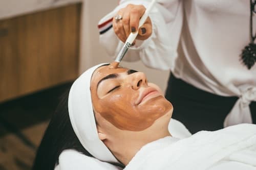 Professional facial treatment session at AngelSky8 with expert beautician applying advanced skincare techniques for glowing, rejuvenated skin